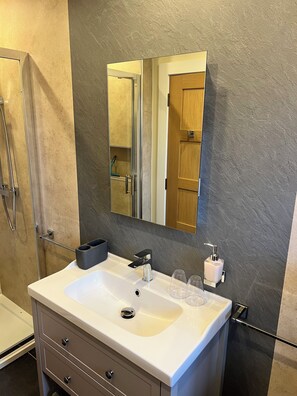 Shower, hair dryer, towels, soap