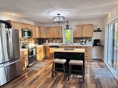 Enjoy beautiful sunsets year round from this spacious 3 BR home on Lake Orono.