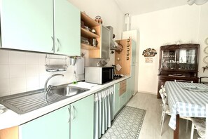 Fridge, microwave, dining tables