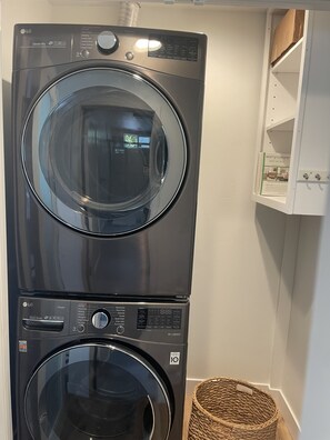 Convenient laundry facilities feature a washer and dryer unit with a digital display.