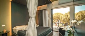 A modern bedroom with a bed, curtains, and a view of the outdoors. - NATURE (Cefalù)
