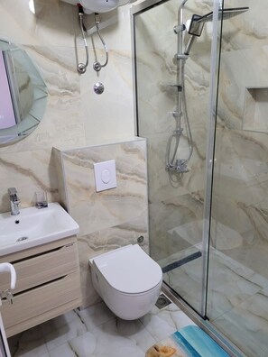 Shower, hair dryer, towels, soap