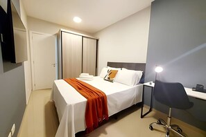 1 bedroom, desk, iron/ironing board, travel crib