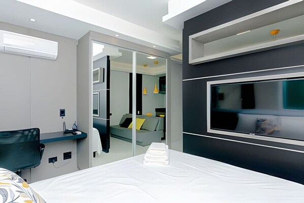 1 bedroom, desk, iron/ironing board, travel crib