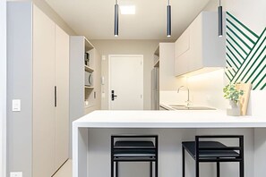 Fridge, microwave, stovetop, coffee/tea maker