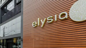 A building with a modern facade and the name 'elysia' prominently displayed. - Apto charmoso de 1 quarto mais sala ed. Elysia (Curitiba)