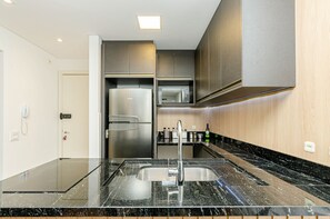 Fridge, microwave, stovetop, coffee/tea maker