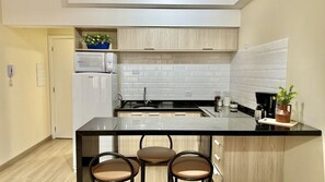 Fridge, microwave, stovetop, coffee/tea maker