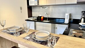 Fridge, microwave, stovetop, coffee/tea maker