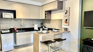 Fridge, microwave, stovetop, coffee/tea maker