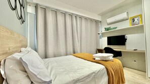 1 bedroom, desk, iron/ironing board, travel crib