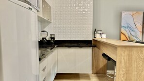 Fridge, microwave, stovetop, coffee/tea maker