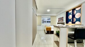 1 bedroom, desk, iron/ironing board, travel crib