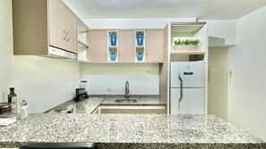 Fridge, microwave, stovetop, coffee/tea maker