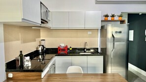 Fridge, microwave, stovetop, coffee/tea maker