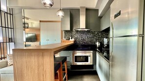 Fridge, microwave, stovetop, coffee/tea maker