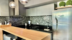 Fridge, microwave, stovetop, coffee/tea maker