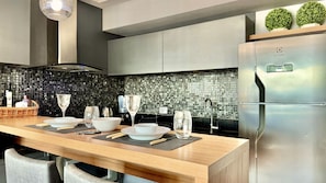 Fridge, microwave, stovetop, coffee/tea maker