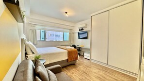 1 bedroom, desk, iron/ironing board, travel crib