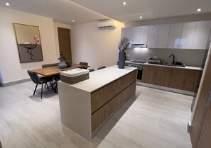 Family Apartment, City View | Private kitchen | Full-sized fridge, microwave, oven, stovetop - cumbres gardens (Cancún)