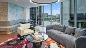 A modern lounge area with a sofa, armchairs, and a coffee table. - Diamonds are Forever! 1Bed/1Bath/ Parking/VIEWS (Brisbane City)