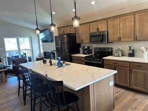 Fridge, microwave, oven, stovetop - Cedar Falls 4BR Near UNI | Hot Tub, Fire Pit & Fenced Yard (Cedar Falls)