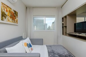 1 bedroom, desk, iron/ironing board, travel crib