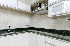 Fridge, microwave, stovetop, coffee/tea maker