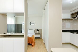 1 bedroom, desk, iron/ironing board, travel crib
