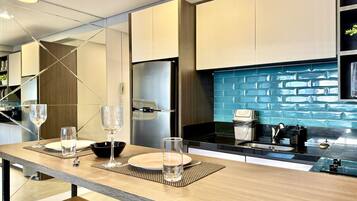 Fridge, microwave, stovetop, coffee/tea maker