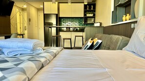 1 bedroom, desk, iron/ironing board, travel crib