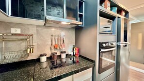 Fridge, microwave, stovetop, coffee/tea maker