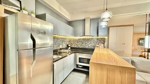Fridge, microwave, stovetop, coffee/tea maker