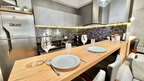 Fridge, microwave, stovetop, coffee/tea maker