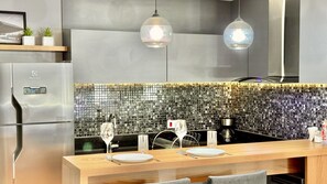 Fridge, microwave, stovetop, coffee/tea maker