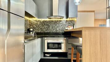 Fridge, microwave, stovetop, coffee/tea maker