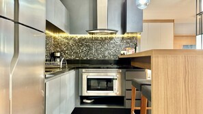 Fridge, microwave, stovetop, coffee/tea maker