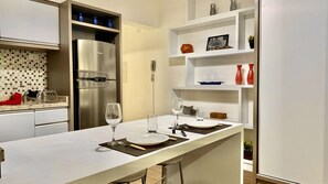 Fridge, microwave, stovetop, coffee/tea maker