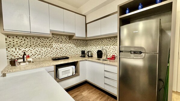 Fridge, microwave, stovetop, coffee/tea maker