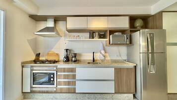 Fridge, microwave, stovetop, coffee/tea maker