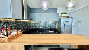 Fridge, microwave, stovetop, coffee/tea maker