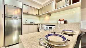 Fridge, microwave, stovetop, coffee/tea maker