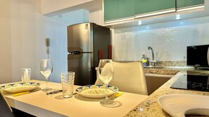 Fridge, microwave, stovetop, coffee/tea maker