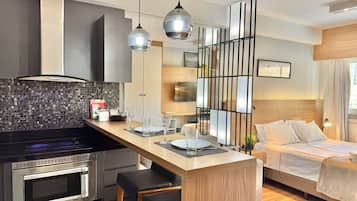 1 bedroom, desk, iron/ironing board, travel crib