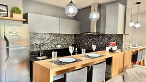 Fridge, microwave, stovetop, coffee/tea maker