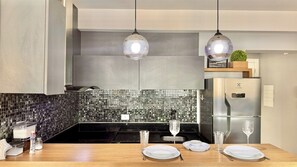 Fridge, microwave, stovetop, coffee/tea maker