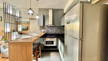 Fridge, microwave, stovetop, coffee/tea maker