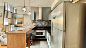 Fridge, microwave, stovetop, coffee/tea maker