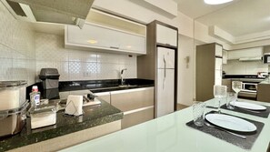 Fridge, microwave, stovetop, coffee/tea maker