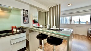 Fridge, microwave, stovetop, coffee/tea maker